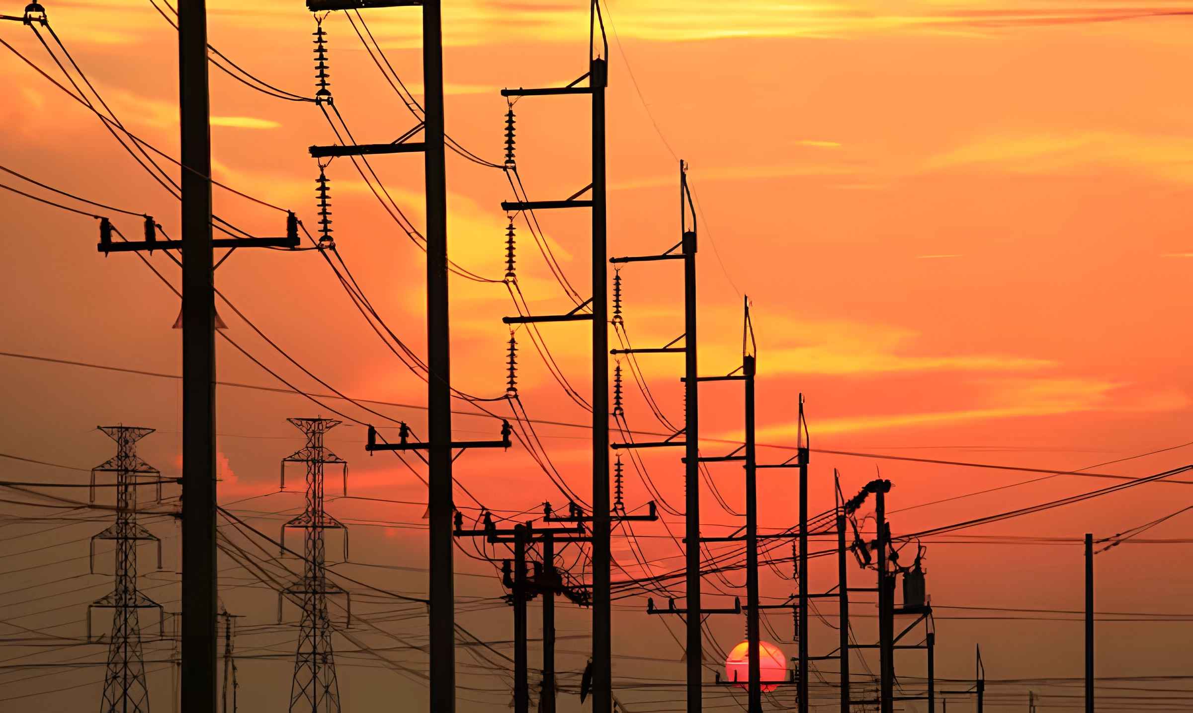 High-voltage transmission lines carrying electricity across the U.S. power grid to support growing electricity demand